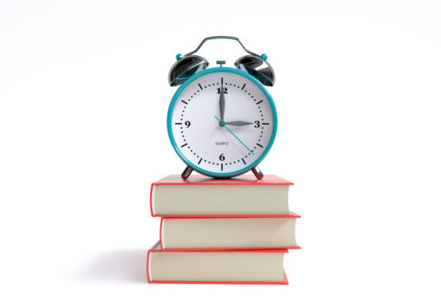 old alarm clock and red books on white background - 3 o'clock - 3d illustration rendering